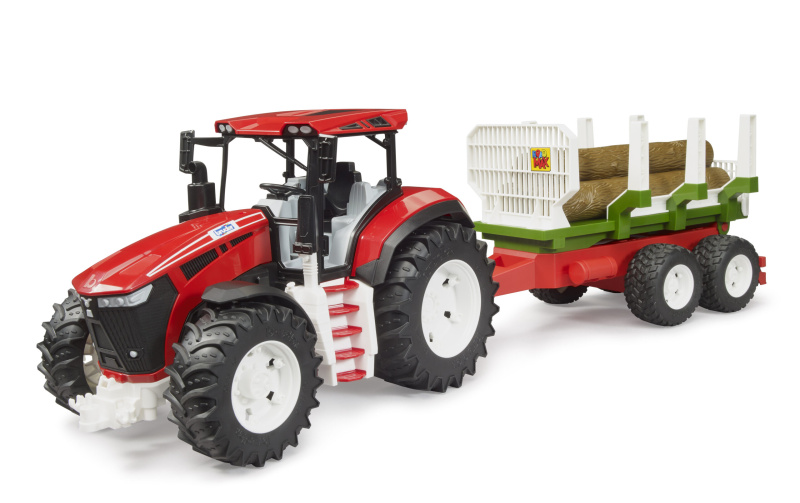 Traktor s přívěsem na klády