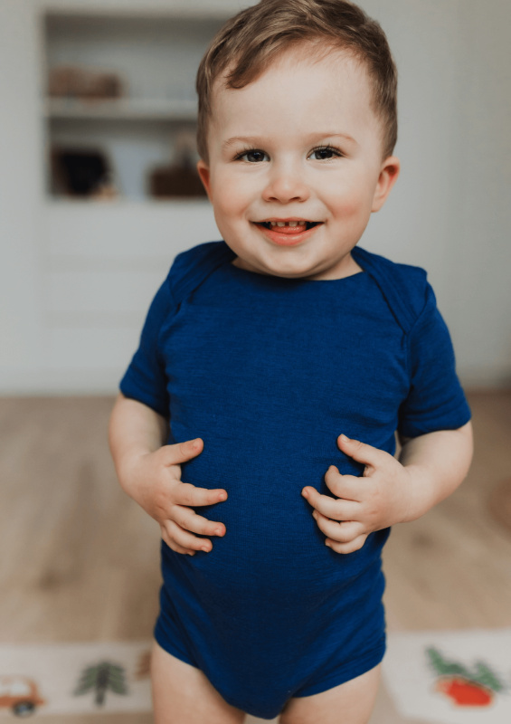 Dětské body z merino vlny a hedvábí Cosilana s krátkým rukávem modré Velikost: 74/80