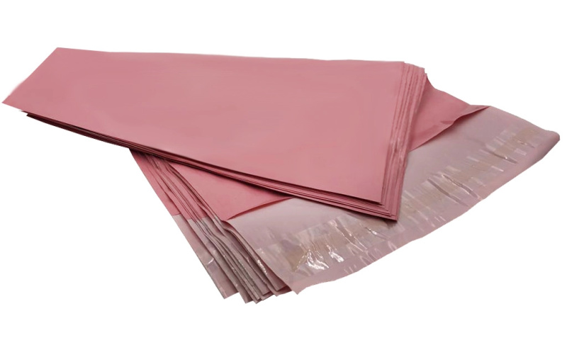 Růžové kurýrní plastové obálky 540 × 700 mm, balení 50 ks