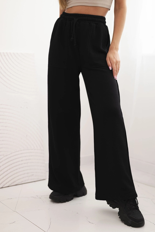 Kesi Dámské tepláky s kapsami a řetízkem Barva: Černá, Velikost: UNI