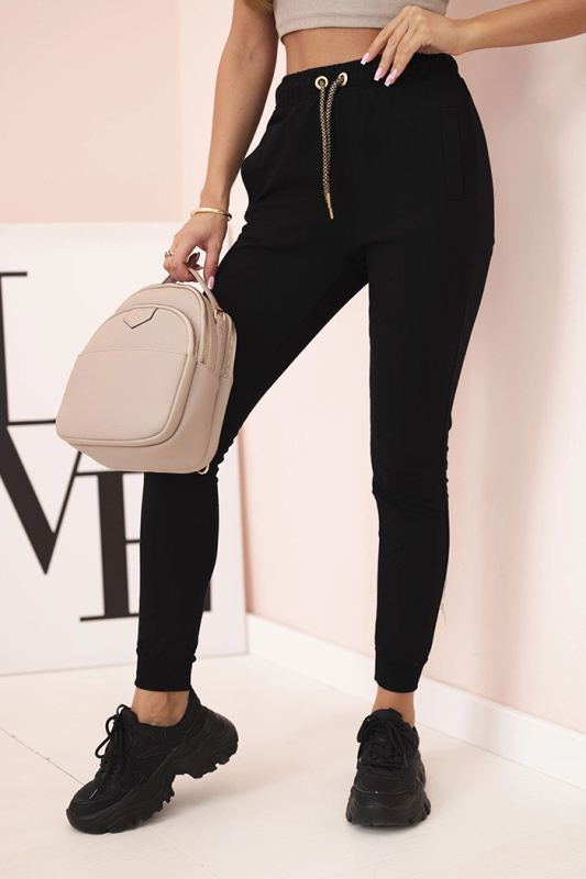 Kesi Dámské bavlněné kalhoty s kapsami a řetízkem béžové Barva: Černá, Velikost: UNI